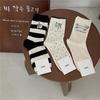 IOULOR Corea del Sur Dongdaemun calcetines de pila otoño calcetines casuales japoneses estilo preppy hasta la pantorrilla para mujer calcetines de moda simples ins