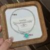 Collar Colgante de Cuatro Hojas con Micro Pavé de Circonita Estilo Retro para Niñas, Cadena para Clavícula Desmontable de Lujo Ligero y Nicho de Alta Gama
