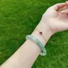Venta al por mayor de fábrica Tianshan Esmeralda Hielo flor flotante pulsera redonda delgada femenina niña redonda Jade pulsera de belleza pulsera tintineante