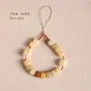 Raíz de Bodhi Cuentas Redondas Gato Asado Carbón Uña de Gato Lanyard para Teléfono Móvil para Mujeres Exquisito y Lindo Gato de la Suerte Corto para Muñeca Colgante Antiperdida Venta al por Mayor