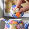 Juego de té de color esmaltado, de cerámica, para una tetera y dos tazas, estilo Palacio de viaje, Wanhua pastel, Año del Dragón, caja de regalo con forma de mano