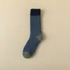 Medias de rizo de invierno engrosadas y alargadas a juego para hombre serie cálida medias de rizo calcetines a prueba de frío