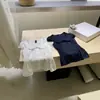 Wgwe10194 Ropa de Mujer Guangzhou Shisanxing Verano Nuevo Cuello en U Ceñido a la Cintura Versátil Camisa de Manga Corta Top Delgado