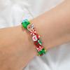 Pulsera elástica navideña para mujer, con diseño de Papá Noel, alce y árbol de Navidad, de cerámica suave y al azar.