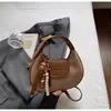 Bolsa de Mão Simples de Alta Costura 2025 Outono e Inverno Nova Versátil Design de Nicho Retro Bolsa de Ombro Único Transversal