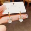 Pendientes elegantes de estilo coreano, sencillos, de moda, con lazo de ojo de gato y hebilla para las orejas, con un diseño de nicho de lujo y un sentido avanzado.