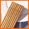 [Autêntico] 5 pares de hashis de bambu carbonizado para uso doméstico Restaurante 24cm hashis esculpidos hashis de peixe dourado esculpidos