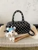 Bolso de lunares de nicho transfronterizo para mujer, nuevo y exquisito minibolso cruzado versátil 2026, bolso cilíndrico de un solo hombro a la moda