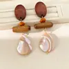 Aretes redondos con cuentas de madera de aguja plateada y cáscara de coco para mujer, nuevo estilo étnico chino, diseño único exagerado, aretes de nicho