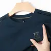 Sudadera con Capucha de Manga Larga y Cuello Redondo Estampada para Hombre 2026 Otoño Nuevo Estilo Casual Simple Cómodo para Hombres Capa Base