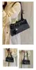 Bolso de axila texturizado transfronterizo para mujer, nuevo modelo 2026, bolso baguette de nicho de lujo ligero, bolso de trabajo, bolso tote vintage esmerilado