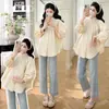 Nova Camisa Babydoll Camada Plissada com Gola Alta Retro Francesa para Gestantes - Primavera 2026