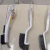 Escova de plástico para atacado, escova doméstica dupla face para remoção de poeira, artefato multifuncional para varrer cama, roupas, sofá, sapatos, escova de limpeza