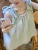 Camisa holgada sin mangas de estilo dulce para mujer, nueva versátil de primavera/verano, informal, que favorece la figura, tipo babydoll con tirantes de corbata