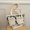 Bolso de hombro para mujer de gran capacidad, bolso tote casual para salidas, bolso de axila versátil con estampado de letras de moda, bolso de nicho y versátil