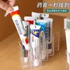 Caja de almacenamiento de medicamentos con compartimentos, un organizador en forma de tubo para medicamentos, un botiquín de primeros auxilios para el hogar y un estante en forma de tubo para almacenar cremas y ungüentos