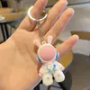 Llavero de muñeca astronauta de dibujos animados transfronterizo llavero de coche creativo llavero de bolsa de pareja lindo regalo pequeño venta al por mayor