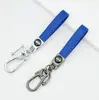 Llavero de piel de cordero transfronterizo para coche con logo de coche de resina, colgante de llave para hombres de negocios, al por mayor en stock