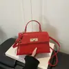 Bolsa de Mão com Fecho de Torção Padrão Crocodilo para Mulheres 2026 Nova Coleção Primavera Estilo Coreano Versátil Bolsa de Ombro Elegante Simples Tendência