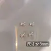 Arte de unhas novo zircônia super flash laço rede de decoração de unhas prata explosões da internet borboleta pequena joias de unha atacado