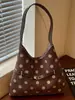 Bolso de mano minimalista de lunares Shuai Mijia, nueva colección 2026, un bolso de mano y bolso de hombro casual único y elegante