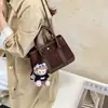 Bolso de mano de felpa de gamuza elegante de alta gama para mujer 2026 Otoño Versión coreana de moda versátil estilo chica popular bolso de un solo hombro cruzado