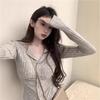 Cárdigan de punto abotonado moderno y elegante con un diseño adelgazante, cuello con volantes y mangas largas para un look chic europeo y americano.