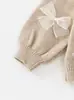 Conjunto de suéter para niña coreano 2026 primavera y otoño nuevo elegante falda tutú suéter de punto con lazo para niños conjunto de dos piezas