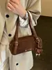 La popular bolsa grande de mujer de este año es el nuevo bolso de hombro cruzado para axila de otoño 2026, un bolso de mano retro de moda para el trabajo