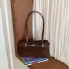 Colección de otoño 2026 transfronteriza: bolso de hombro de nicho de alta gama para mujer, estilo retro para ir al trabajo, bolso de axila, bolso tote casual