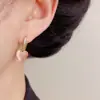 Estilo Francés Elegante Moderno Dulce Versátil Ojo de Gato Corazón Aretes de Botón Personalizados Lujo Ligero Fresco Simple Colgantes de Aretes Venta al por Mayor