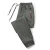 Pantalones deportivos para hombre Primavera Nuevo talla grande holgados pantalones de chándal tobilleros tejido de punto moda moderno cremallera camuflaje pantalones casuales