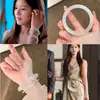 Pulseira de Sino de Mão Redondo Estilo Livro Vermelho Pequeno, Pulseira de Vidro Lua Branca, Pulseira de Fada Fresca e Versátil, Pulseira Novo Estilo Chinês