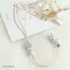 Colgantes de cerámica de Jingdezhen recién cocidos en horno, perfectos para novias, estudiantes y como dijes para bolsos.; cordones con borlas únicos que no se decoloran