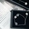 Pulsera de flor irregular súper hada VERA chapada en 18K Flash microincrustación circonita 3A borla mano para el cabello