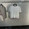 Nuevo producto TB de tejido de punto con cuello redondo y mangas cortas, tejido de lino, moderno, con costuras que combinan con todo, para verano.