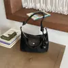 Bolso de axila de estilo francés de nicho transfronterizo para mujer, nuevo bolso de moda tipo albóndiga de gamuza para el trabajo, bolso de hombro y cruzado casual
