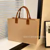 Bolso de mano nuevo de fieltro transfronterizo se puede imprimir logo moderno versátil creativo duradero bolsa de almacenamiento hecha a mano