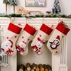 Decoraciones navideñas nuevas transfronterizas borde rojo lino de imitación estampado de dibujos animados calcetines navideños calcetines de regalo para niños colgante para árbol