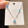 Collar con colgante de flor de la suerte de perla y circón estilo coreano, sensación de lujo ligero y alta gama, cadena para la clavícula, accesorio de moda versátil estilo bosque