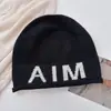 Gorro de Lana Mixta para Adultos, Estilo Igual para Pareja Aim Entity, con Protección para las Orejas, Casual Neutro con Bordes Ligeramente Enrollados