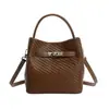 Bolso pequeño retro de alta gama para mujer 2026 nuevo estilo de moda bolso cruzado versátil bolso de mano popular estilo caliente bolso cubo
