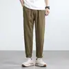 Promoção calça afunilada elástica de seda gelada com toque fresco masculina verão 2025 nova malha waffle cor sólida emagrecedora calça de nove pontos