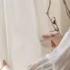 Nuevo estilo de cortinas translúcidas con patrón de ondas de agua, que ofrecen privacidad mientras permiten el paso de la luz, adecuadas para salas de estar y balcones, proporcionando protección solar y disponibles en diseños personalizados.