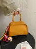 Bolsa pequena estruturada com padrão trançado para mulheres, nova bolsa quadrada pequena casual 2026, bolsa transversal de mão para o verão de alta qualidade para o trabalho