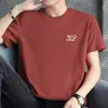 Camiseta Masculina de Algodão Puro Manga Curta Top Solto Camiseta Estilo Americano Algodão Estampado com Letras Manga Meia Manga Gola Redonda Camiseta Básica