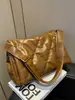 Bolsa de Plumas para Mujer Otoño e Invierno 2025 Nueva Tendencia Coreana Acolchada Cuadrada Pequeña Bolso Versátil de Gran Capacidad para Hombro Cruzado