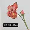 Las flores de iris artificiales de tallo corto y aspecto lujoso son decoraciones exquisitas para una sala de estar acogedora, una decoración de oficina que inspira calidez y adornos comerciales.