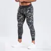 Otoño e invierno Europa y Estados Unidos transfronterizo nuevos pantalones fitness ocio running deportes entrenamiento hombres pie pequeño pantalones ajustados