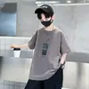 2026 Novo Estilo de Verão Camiseta Casual Americana Infantil com Estampa de Xícara de Chá Manga Curta Solta Gola Redonda para Meninos e Crianças Maiores